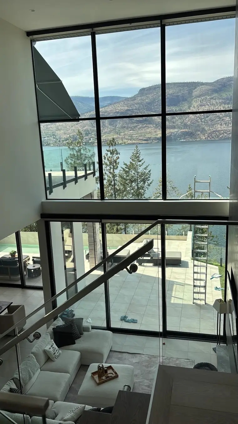 Freshly cleaned floor-to-ceiling windows overlooking Okanagan Lake