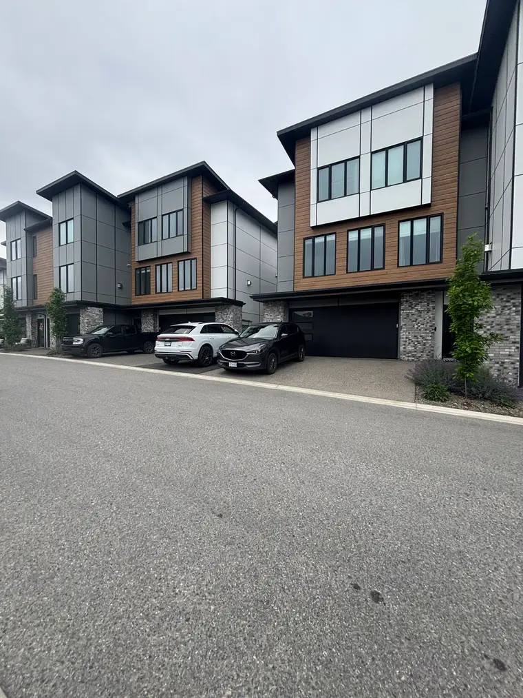 Completed modern strata townhomes with clean exterior windows